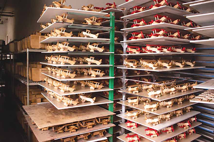 Shelves of wooden handmade planes.